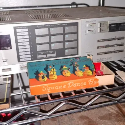 Sale Photo Thumbnail #177: Vintage Sony STR-VX550 quartz lock digital synthesizer AM/FM stereo receiver, along with small novelty items on a wire shelf.