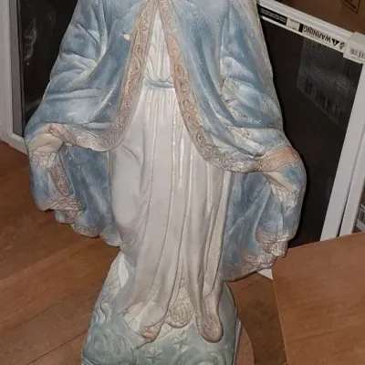 Sale Photo Thumbnail #256: Vintage painted plaster or concrete Virgin Mary statue featuring a light blue cloak and standing on a cloud-motif base.