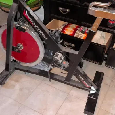 Sale Photo Thumbnail #223: Pro-Form 290 SPX stationary exercise bike with a red flywheel and adjustable seat.