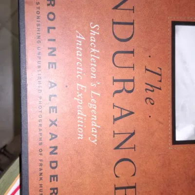 Sale Photo Thumbnail #182: Hardcover edition of "The Endurance: Shackleton's Legendary Antarctic Expedition" by Caroline Alexander, featuring black-and-white historical photographs.