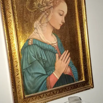 Sale Photo Thumbnail #121: Vintage framed Madonna wall art depicting a profile portrait after Filippo Lippi, set in an ornate pointed Gothic-style gilt frame.