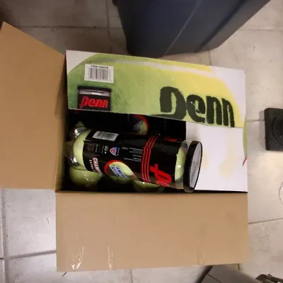 Sale Photo Thumbnail #199: Cardboard case containing multiple cans of Penn Championship tennis balls.