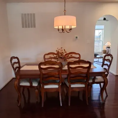 Sale Photo Thumbnail #25: French Provincial style wooden dining table set featuring six ladder-back chairs with light upholstery and cabriole legs.