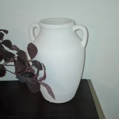 Sale Photo Thumbnail #22: Modern white matte-finished terracotta amphora vase with dual handles, displayed on a dark console table.