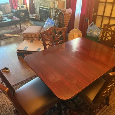 Sale Photo Thumbnail #121: Mahogany dining room table and 6 spider-back chairs with 4 protective covers and protective table cover.