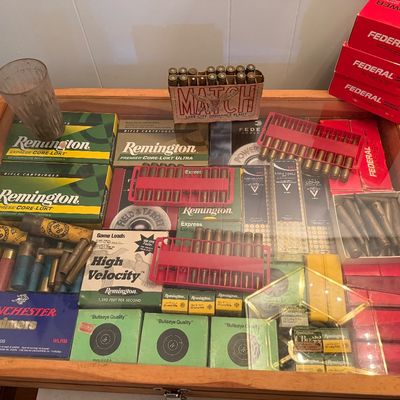 Sale Photo Thumbnail #125: Ammunition boxes, loose cartridges, shotgun shells, and Winchester primers.