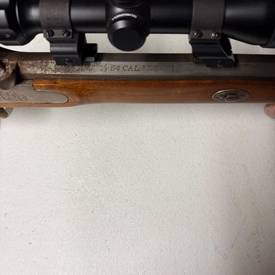Sale Photo Thumbnail #11: Thompson/Center Arms Renegade .54 caliber muzzleloader rifle with a mounted Bushnell scope.