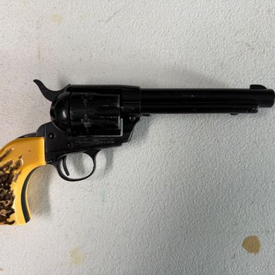 Sale Photo Thumbnail #40: Vintage Hawes Western Marshal .22 caliber single-action revolver with black finish and faux stag horn grips.