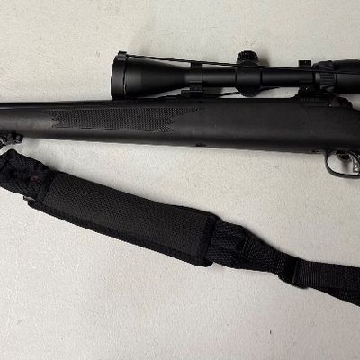 Sale Photo Thumbnail #32: Savage Arms Model 110 bolt-action rifle and padded shoulder sling.