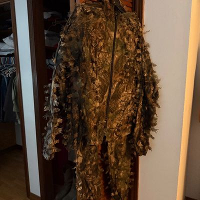 Sale Photo Thumbnail #82: Full-body camouflage ghillie suit featuring 3D leafy foliage details for hunting or tactical concealment.