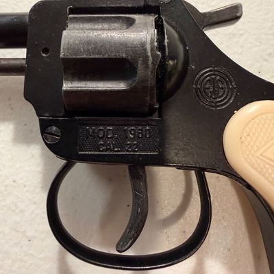 Sale Photo Thumbnail #4: Vintage EIG Model 1960 .22 caliber starter pistol with a black finish and off-white molded grips.