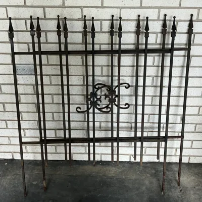 Sale Photo Thumbnail #233: Pair of antique-style black wrought iron garden fence sections featuring decorative scrollwork and spear-top finials.