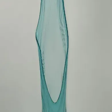 Sale Photo Thumbnail #34: Mid-century modern turquoise blue swung glass floor vase featuring a ribbed texture and an elongated pulled lip.