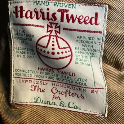 Sale Photo Thumbnail #160: Authenticity label for a vintage Harris Tweed handwoven Scottish wool jacket, produced for Dunn & Co.