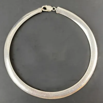 Sale Photo Thumbnail #19: Sterling silver wide herringbone collar necklace featuring a lobster claw clasp, in very good condition.