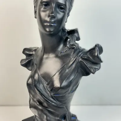 Sale Photo Thumbnail #53: Black patinated metal or resin bust sculpture of a woman in Art Nouveau style, mounted on a square black plinth.