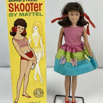 Sale Photo Thumbnail #115: Vintage 1965 Mattel Skipper's Friend Skooter doll with original yellow box, wearing a colorful butterfly-appliqué dress.