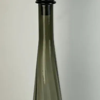 Sale Photo Thumbnail #33: Mid-century modern smoked olive green glass decanter with a tall flame-shaped stopper and ribbed conical body.