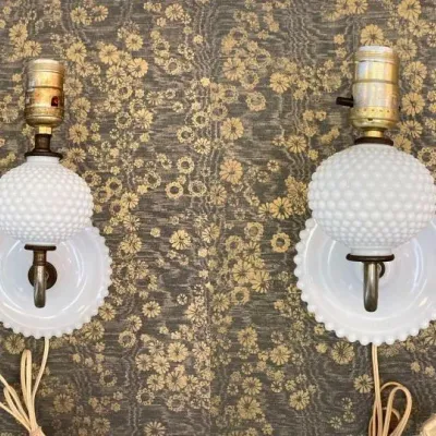 Sale Photo Thumbnail #39: Pair of vintage white hobnail milk glass electric wall sconces with brass sockets and plug-in cords.