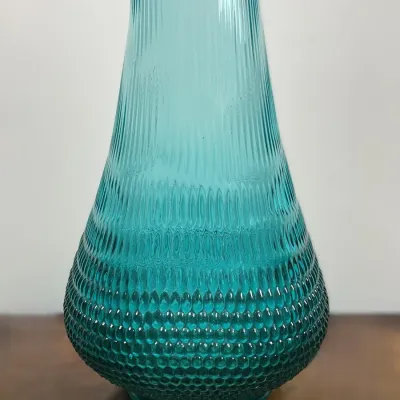Sale Photo Thumbnail #36: Vintage aqua teal textured glass vase featuring a hobnail base that transitions into vertical ribbed detailing along the neck.