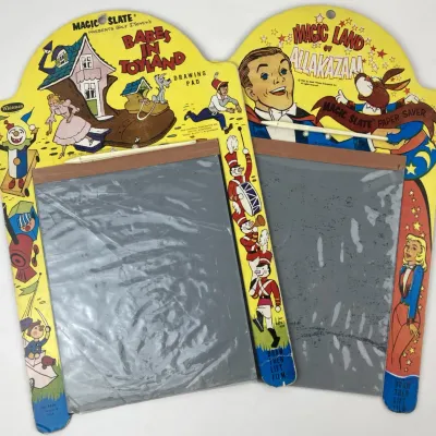 Sale Photo Thumbnail #185: Pair of vintage Whitman Magic Slate paper saver pads, including Walt Disney's Babes in Toyland and The Magic Land of Allakazam, circa 1960s.