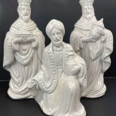 Sale Photo Thumbnail #212: Set of three vintage pearlized white ceramic Three Wise Men nativity figurines, featuring intricate molded drapery and metallic-sheen finishes.