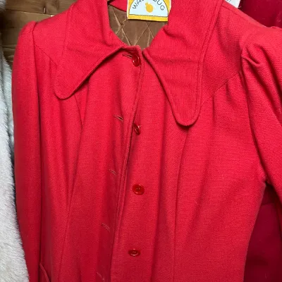Sale Photo Thumbnail #149: Vintage bright red Waterbug coat featuring a wide statement collar, button closure, quilted lining, and slight shoulder puffing.