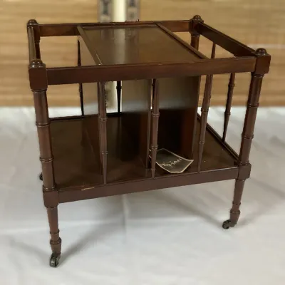 Sale Photo Thumbnail #60: Vintage Hekman mahogany rolling magazine rack end table with spindle side rails and divider slots.