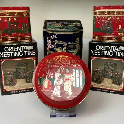 Sale Photo Thumbnail #45: Vintage Asian-style decorative nesting tin sets with original boxes, featuring traditional Chinoiserie and Ming Dynasty motifs.