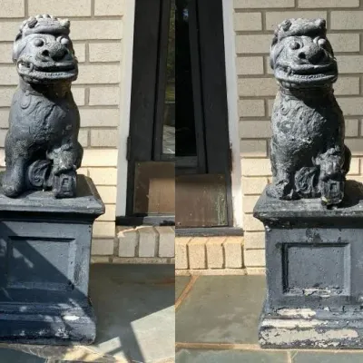 Sale Photo Thumbnail #215: Pair of black cast metal Foo Dog statues on matching square pedestals, featuring weathered paint detailing.