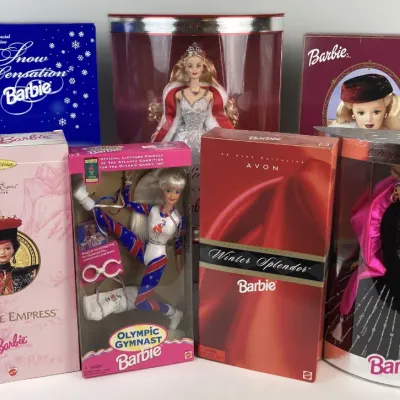 Sale Photo Thumbnail #190: Collection of seven 1990s Special Edition and Collector Edition Barbie dolls in their original packaging, including Chinese Empress, Olympic Gymnast, and Happy Holidays dolls.