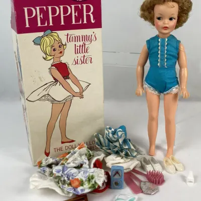 Sale Photo Thumbnail #116: Vintage 1960s Ideal Pepper doll set, featuring Tammy's little sister in a blue romper, original box, extra clothing, and various small accessories.
