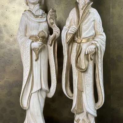Sale Photo Thumbnail #222: Pair of vintage Hollywood Regency Asian-style emperor and empress chalkware statues with ivory finish and metallic gold accents, mounted on brass-tone bases.