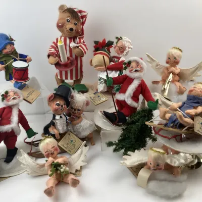 Sale Photo Thumbnail #205: Collection of vintage Annalee Christmas dolls, including Santas, angels, mice, and a bear, featuring painted felt faces and original tags.