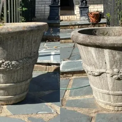 Sale Photo Thumbnail #214: Large concrete outdoor planter with floral and swag relief details, featuring a weathered finish.