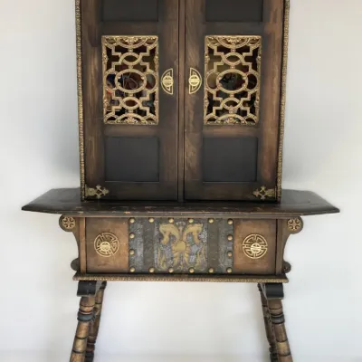 Sale Photo Thumbnail #79: Ornate Asian-inspired wooden cabinet featuring brass pierced work panels, decorative hardware, and carved splayed legs.