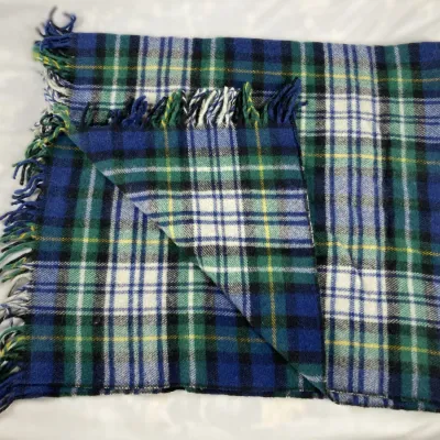 Sale Photo Thumbnail #105: Blue and green plaid wool throw blanket with fringed edges.