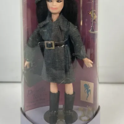Sale Photo Thumbnail #118: Vintage 1960s Topper "Dawn" style Private Eye fashion doll by The Go-Go's, preserved in its original cylindrical plastic display case.
