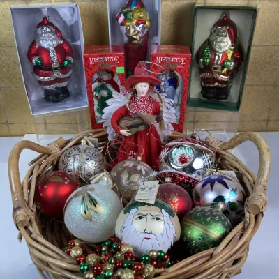 Sale Photo Thumbnail #236: Collection of vintage glass Christmas ornaments filled inside a woven basket, accompanied by boxed Santa and angel figures from the Mistletoe Magic Collection.