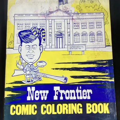 Sale Photo Thumbnail #231: Vintage 1960s New Frontier Comic Coloring Book featuring political satire of John F. Kennedy, showing light cover wear and aging.