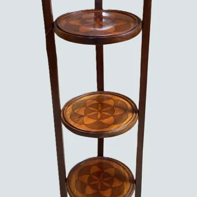 Sale Photo Thumbnail #15: Three-tier vintage mahogany folding cake stand featuring geometric floral marquetry wood inlay on each round shelf.