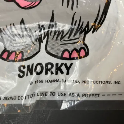 Sale Photo Thumbnail #227: Vintage 1968 Hanna-Barbera Snorky plastic puppet bag, featuring printed character artwork and copyright text.