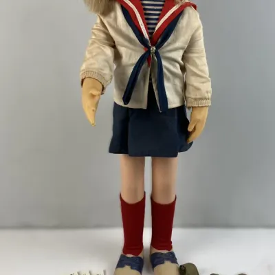Sale Photo Thumbnail #121: Vintage 1960s Mattel Charmin' Chatty doll wearing her original sailor outfit and glasses, accompanied by additional accessories, booklets, and miniature records.