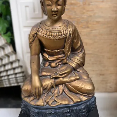 Sale Photo Thumbnail #7: Seated bronze-finish Buddha statue depicting the Earth Witness mudra, mounted on a dark carved pedestal base.