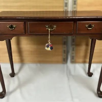 Sale Photo Thumbnail #52: Traditional Queen Anne style mahogany accent desk featuring cabriole legs, pad feet, and brass bail pulls.