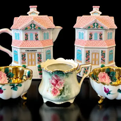 Beautiful estate collection of four decorative porcelain and pottery pieces, featuring an elegant Ro