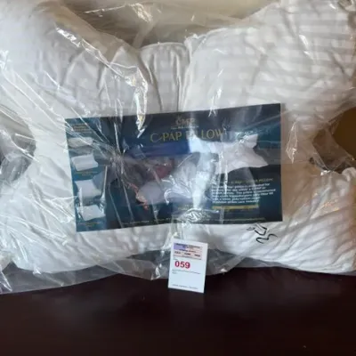 Contoured C-PAP pillow by Crown Medical Products, sealed in its original plastic packaging.
