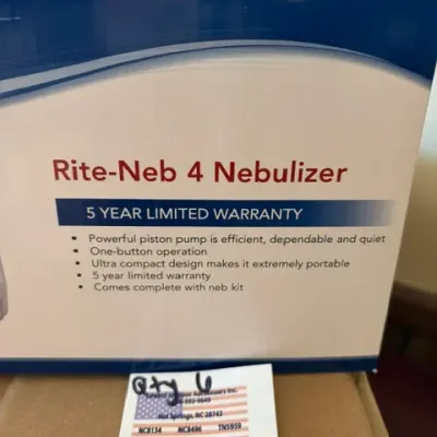 Boxed Rite-Neb 4 compressor nebulizer, featuring a compact design and one-button operation.