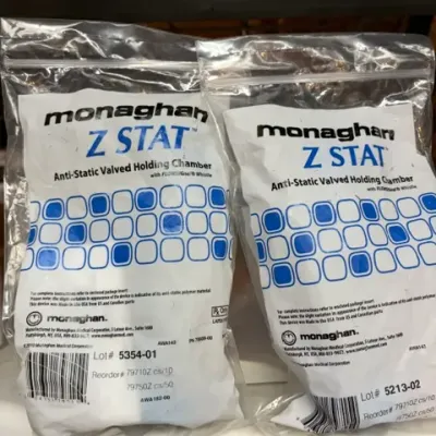 Two Monaghan Z STAT anti-static valved holding chambers for inhalers, sealed in original clear plastic packaging.