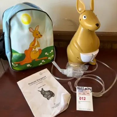 Roscoe Kangaroo pediatric compressor nebulizer system, complete with kangaroo-shaped unit, matching carrying case backpack, tubing,...